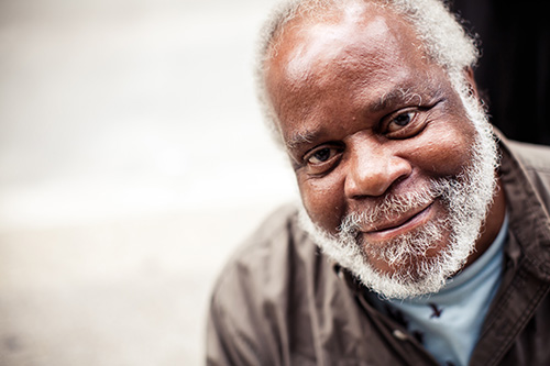 Close up of Senior African American man with white beard smiling